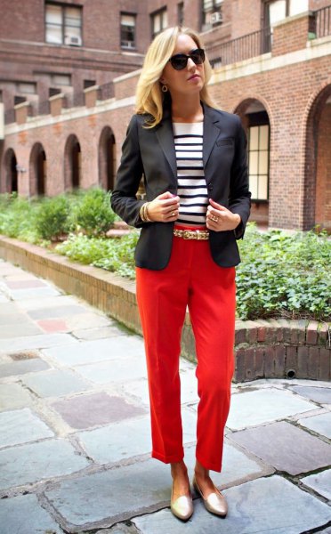 black blazer with red cropped trousers and gold burner