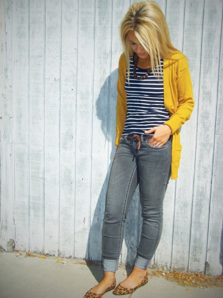 yellow sweater jacket with black and white striped tank top