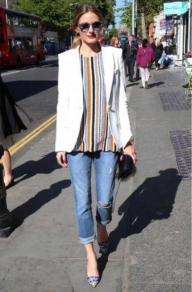 orange and black vertical striped blouse and cuffed jeans