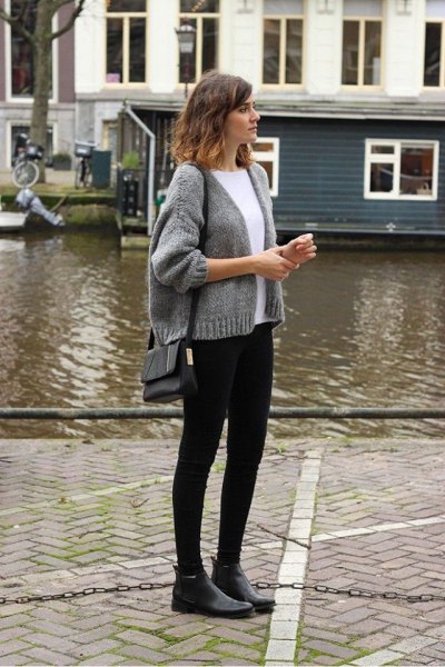 gray short knit cardigan with crew neck sweater and black skinny jeans
