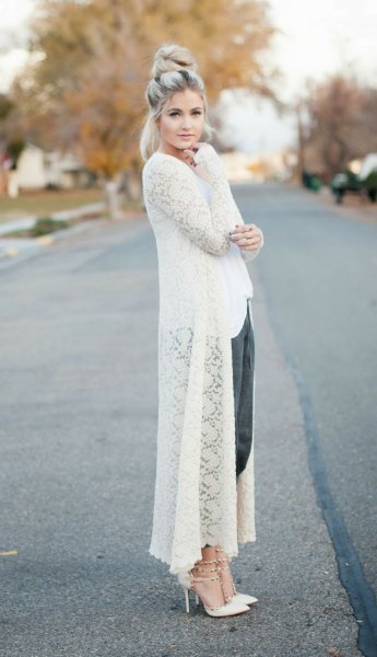 white maxi crocheted sweater cardigan with black cropped pants