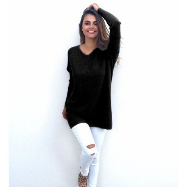black sweater with v-neck and white ripped skinny jeans