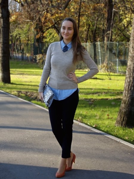 light gray sweater with v-neck and blue collar shirt and tie