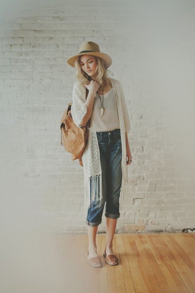 white fringed longline cardigan with white straw hat and pink pink sandals