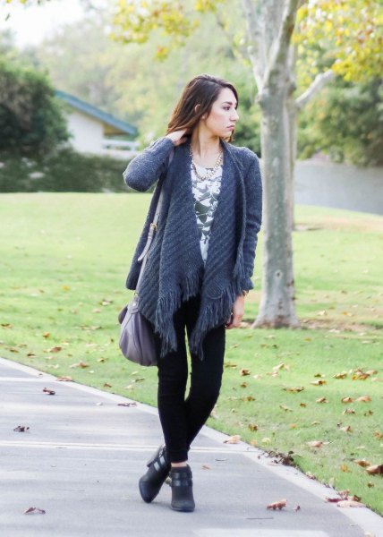 purple fringed knit cardigan with black skinny jeans