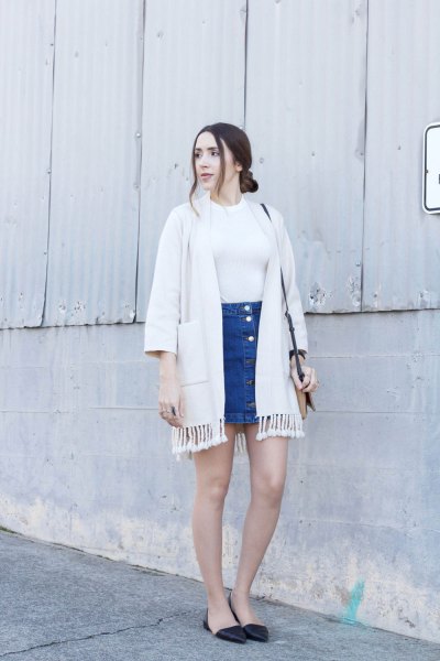 white fringed jacket with blue mini denim skirt