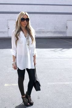 white long-line shirt with black leggings and cutout boots