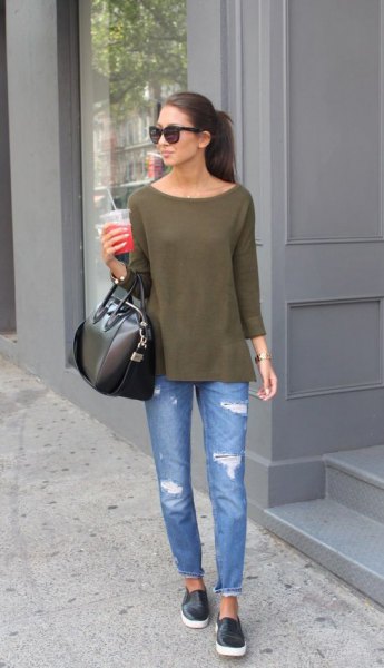 green boat neck blouse with blue ripped slim fit jeans