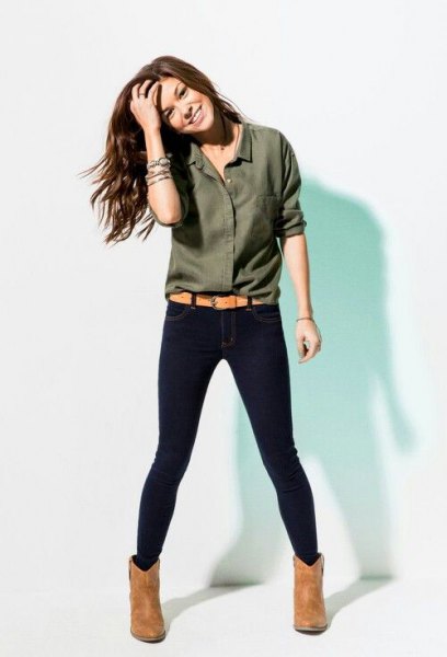green button shirt with dark blue skinny jeans and camel boots