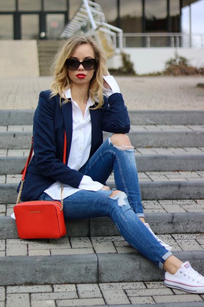 navy blazer with slim fit cuffed jeans and white low top sneakers