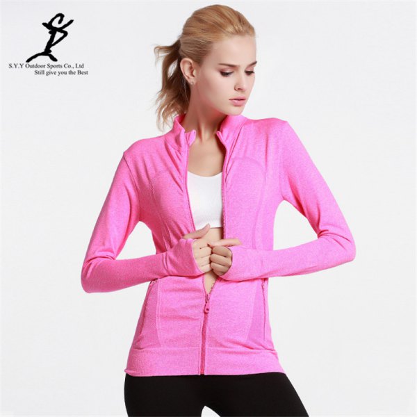 warm pink jacket with white sports bra top