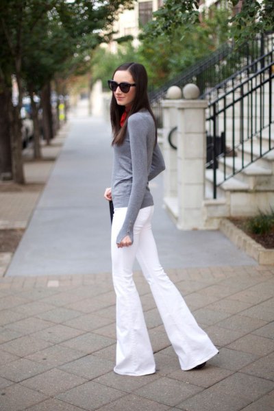 gray long sleeve fitted tee with white puffed jeans