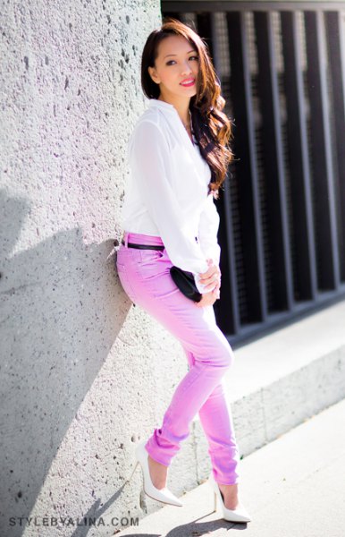 white chiffon blouse with colored belt in slim fit jeans
