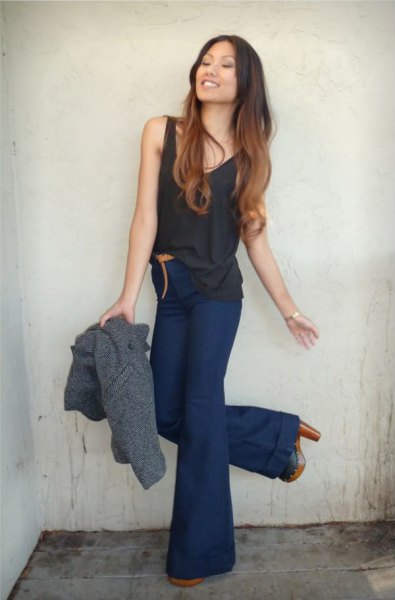 black tank top with navy blue high waist flared jeans