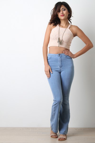 cropped shape fitting light pink vest top with light blue high-rise housing