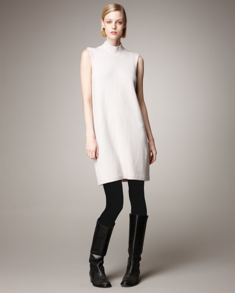 white mock neck sleeveless cashmere sweater with leggings and boots