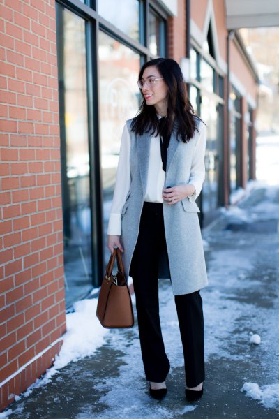 gray wool long vest with white blouse and black chinos with straight legs