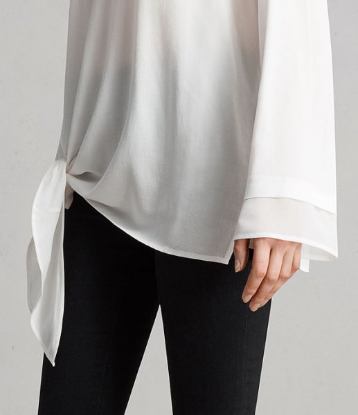 white knit long wide sleeve chiffon tunic shirt with black skinny jeans