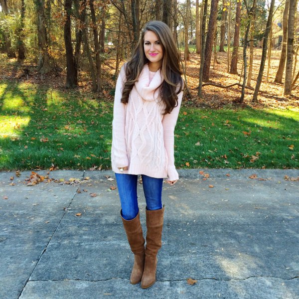 white cable knit chunky sweater with blue jeans and over the knee boots