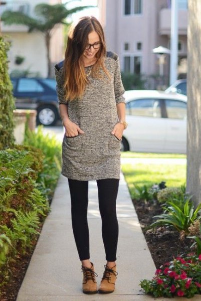 small gray half-heated tunic top with black leggings