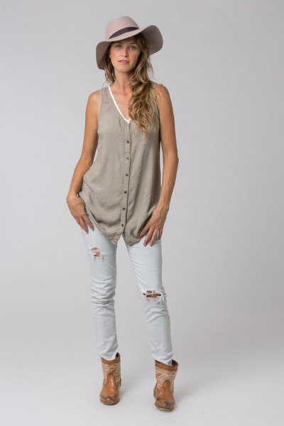 gray v-neck button-up tunic with white ripped skinny jeans