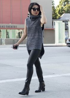 Heather gray sleeveless sweater with black leather pants