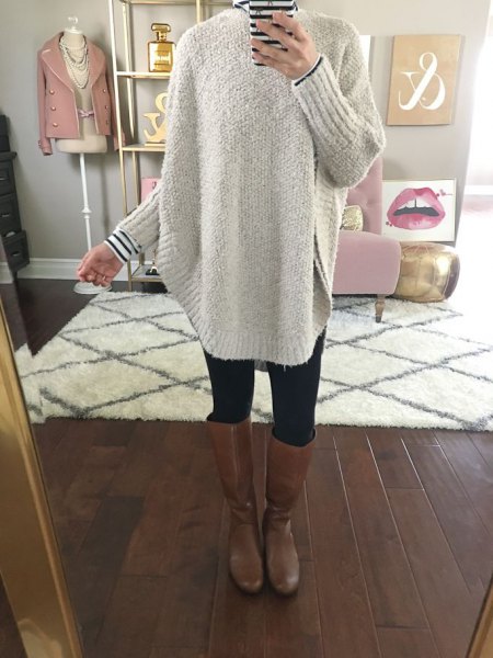 gray chunky sweater with striped tee and knee high leather shoes