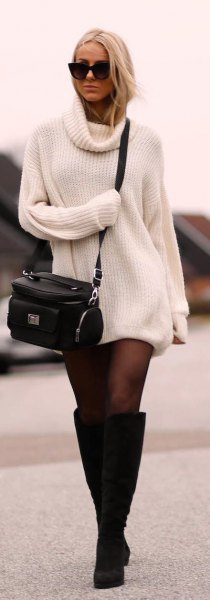 ribbed white sweater dress with black socks and high-heeled boots at the knee