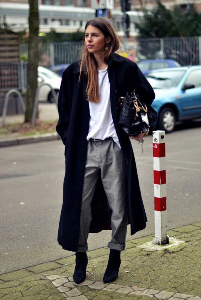 long black wool coat with white sweater and gray straight leg pants