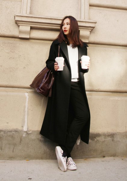 black longline blazer skirt with white v-neck sweater and canvas sneakers