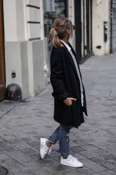 black long coat with gray sweater and white button up shirt