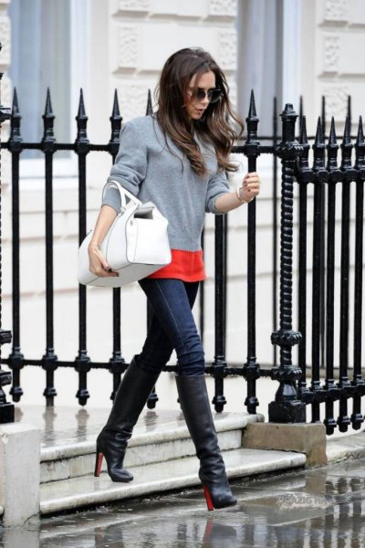 gray sweater with orange t-shirt and blue skinny jeans