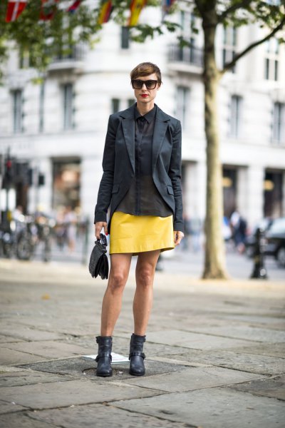 black blazer with yellow leather mini skirt and ankle boots in ankle