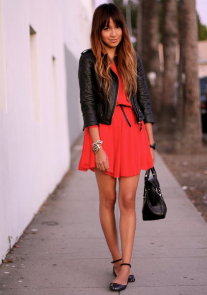 orange mini-pleated dress with black leather jacket and leather leather in the ankle