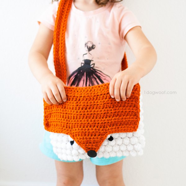 brown and white fox shaped knitted shoulder bag with light yellow tee
