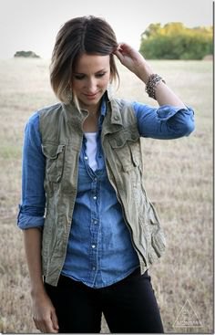 olive vest with chambray light blue shirt and dark jeans