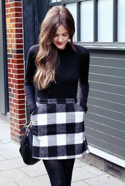 black long sleeve fitted tee with gray and white plaid wool mini skirt with pockets