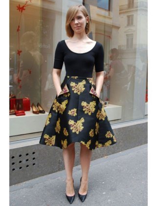 black neckline of shoe neck shape and matching top with floral printed knee length skater skirt