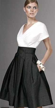 white v-neck wrap blouse with black waist flared skirt with high waist with pockets
