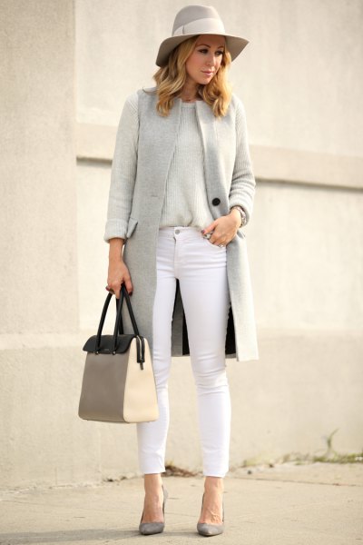 gray floppy hat with matching vest and white cropped jeans