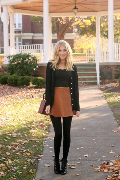 black cardigan with black crop top and brown high skirt in mini skirt