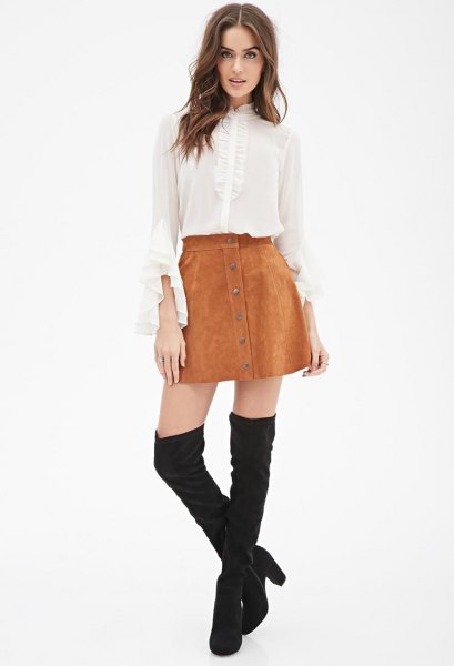 white bell sleeve chiffon blouse with mini suede skirt and high boots in the thigh