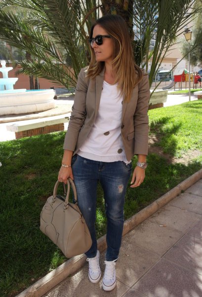 olive khaki blazer with white sweater and blue jeans