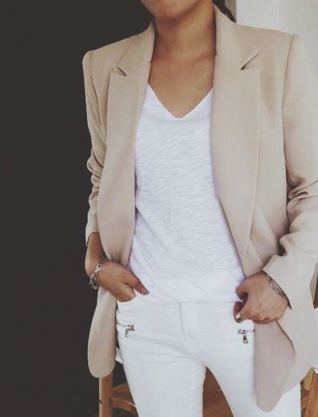 light gray khaki blazer with white v-neck top and skinny jeans