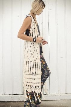 white crochet maxi length knitted hippie vest with floral printed leggings