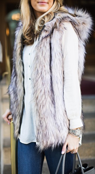 gray hood vest in fur in fur with white button-down blouse and skinny jeans