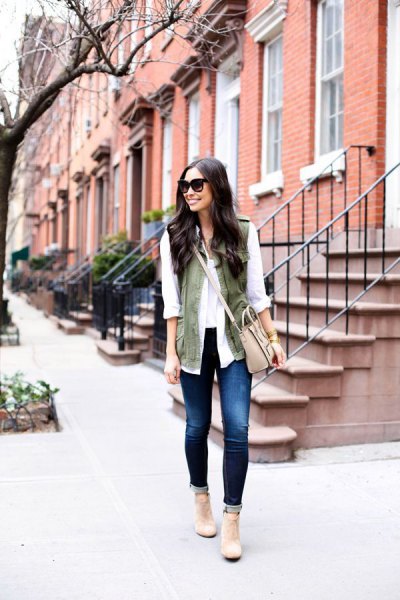 white chiffon blouse with olive green vest and light pink shoulder bag