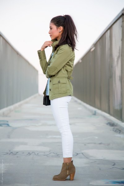pink pink military jacket with white skinny slim jeans and camel boots