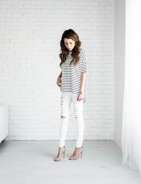 black and white striped t-shirt and ripped white jeans