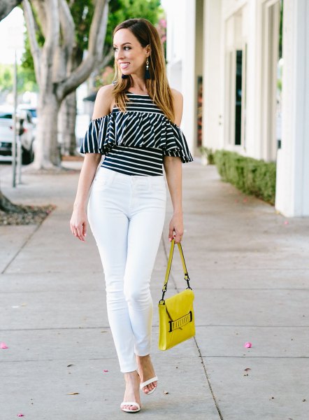 black and white striped cold shoulder ruffle top with yellow leather handbag